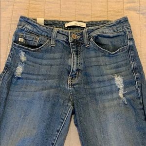 Distressed blue jeans